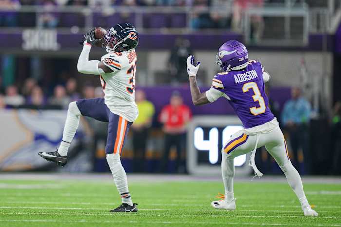 Nov 27, 2023; Minneapolis, Minnesota, USA; Chicago Bears cornerback Jaylon Johnson (33) intercepts a pass intended for Minnesota Vikings wide receiver Jordan Addison (3) in the second quarter at U.S. Bank Stadium. Mandatory Credit: Brad Rempel-USA TODAY Sports